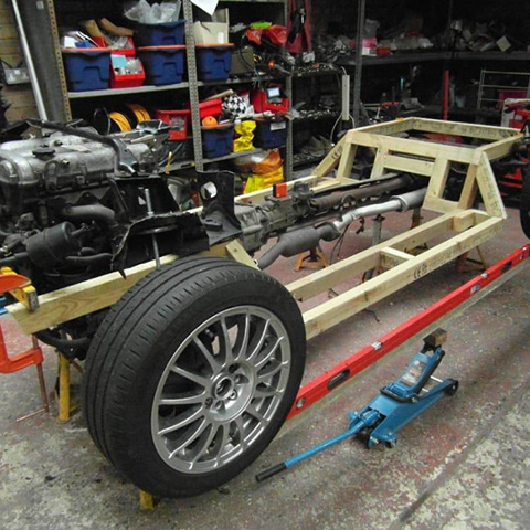 the chassis of a classic car being repaired